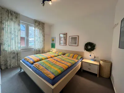 Ein Bett oder Betten in einem Zimmer der Unterkunft Dünenwind, Ferienwohnung 3