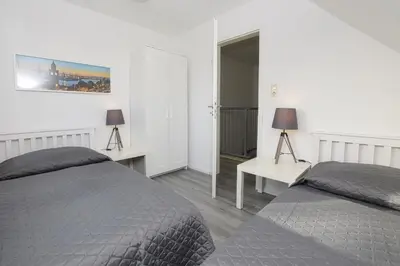 Ein Bett oder Betten in einem Zimmer der Unterkunft Haus im Törn Haus im Törn, Whg 1