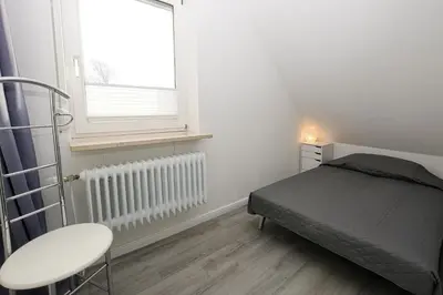 Ein Bett oder Betten in einem Zimmer der Unterkunft Haus im Törn Haus im Törn, Whg 4