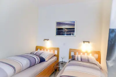 Ein Bett oder Betten in einem Zimmer der Unterkunft Strandhochhaus SHE3