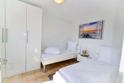 Ein Bett oder Betten in einem Zimmer der Unterkunft Haus am Waldbad AW15