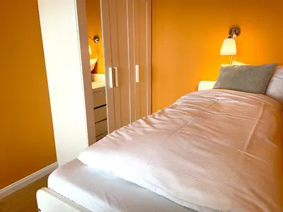 Ein Bett oder Betten in einem Zimmer der Unterkunft Frische Brise FeWo12 09