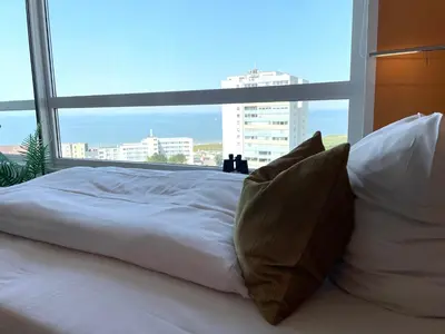 Ein Bett oder Betten in einem Zimmer der Unterkunft Frische Brise FeWo12 09
