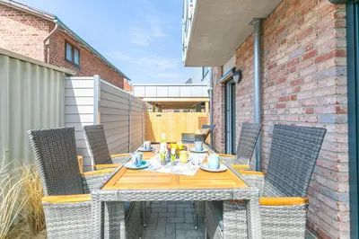 Ein Balkon oder eine Terrasse in der Unterkunft Deichidyll Deichidyll, Whg Glücksmomente