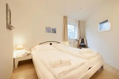 Ein Bett oder Betten in einem Zimmer der Unterkunft Stranddüne - Cuxi