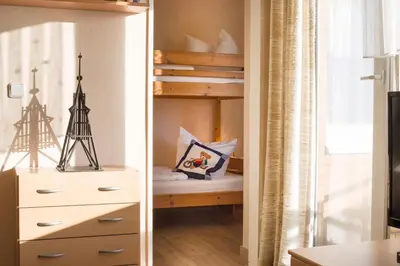 Ein Bett oder Betten in einem Zimmer der Unterkunft Apartmenthaus Frauenpreiss FeWo 205