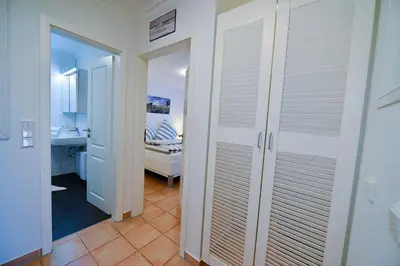 Ein Bett oder Betten in einem Zimmer der Unterkunft Haus Residenz Dünenweg RD19