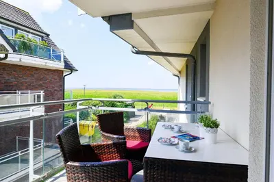Ein Balkon oder eine Terrasse in der Unterkunft Haus Dünenweg 37 DU03