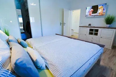 Ein Bett oder Betten in einem Zimmer der Unterkunft Am Sahlenburger Strand AS06
