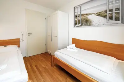 Ein Bett oder Betten in einem Zimmer der Unterkunft Strandpalais PA07