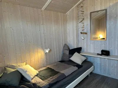 Ein Bett oder Betten in einem Zimmer der Unterkunft Nordseeperle-Ferienhaus