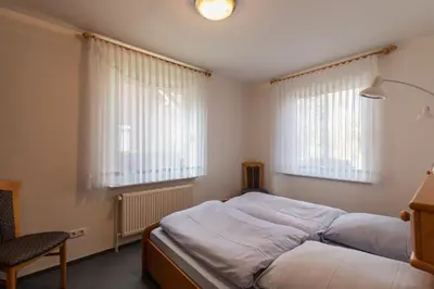 Ein Bett oder Betten in einem Zimmer der Unterkunft Haus Meeresrauschen, Whg 1