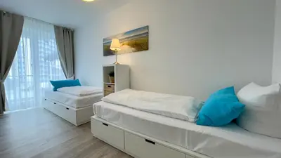 Ein Bett oder Betten in einem Zimmer der Unterkunft Nordseebrandung A3 1