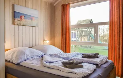 Ein Bett oder Betten in einem Zimmer der Unterkunft Awesome Home In Otterndorf With Sauna