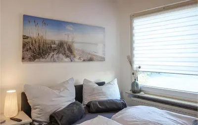 Ein Bett oder Betten in einem Zimmer der Unterkunft Amazing Apartment In Otterndorf