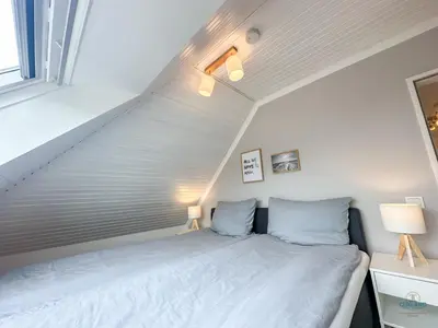 Ein Bett oder Betten in einem Zimmer der Unterkunft Heimathafen Whg 8 Am Ahoi Bad