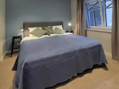Ein Bett oder Betten in einem Zimmer der Unterkunft Strandpalais Apartment Landgang