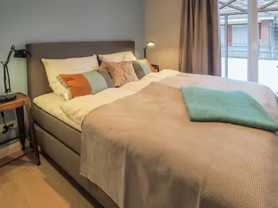 Ein Bett oder Betten in einem Zimmer der Unterkunft Strandpalais Apartment Kombüse