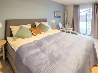 Ein Bett oder Betten in einem Zimmer der Unterkunft Strandpalais Apartment Ausguck