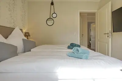 Ein Bett oder Betten in einem Zimmer der Unterkunft Buhne 11