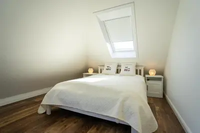 Ein Bett oder Betten in einem Zimmer der Unterkunft Residenz Rosengarten Wohnung Meerjungfrau 2