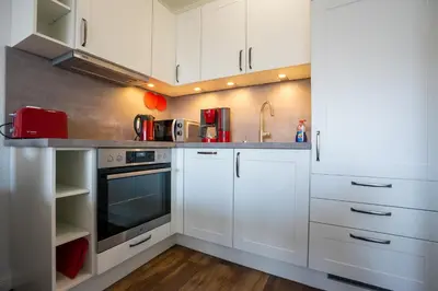 Küche/Küchenzeile in der Unterkunft Residenz Rosengarten Wohnung Meerjungfrau 1