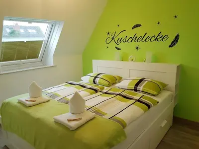 Ein Bett oder Betten in einem Zimmer der Unterkunft Kleine Nixe Dünenblick