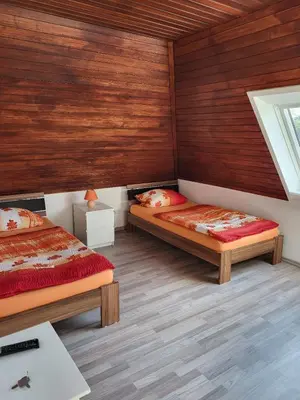 Ein Bett oder Betten in einem Zimmer der Unterkunft Kleine Nixe Seestern