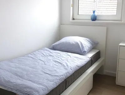 Ein Bett oder Betten in einem Zimmer der Unterkunft Nordseedüne, Ferienwohnung 11