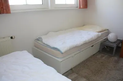 Ein Bett oder Betten in einem Zimmer der Unterkunft Nordseedüne, Ferienwohnung 9