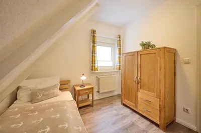 Ein Bett oder Betten in einem Zimmer der Unterkunft Kampweg 28