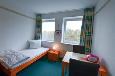 Ein Bett oder Betten in einem Zimmer der Unterkunft Haus Nordseebrandung NB43