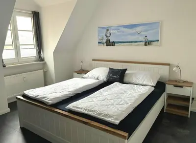 Ein Bett oder Betten in einem Zimmer der Unterkunft Wattnett