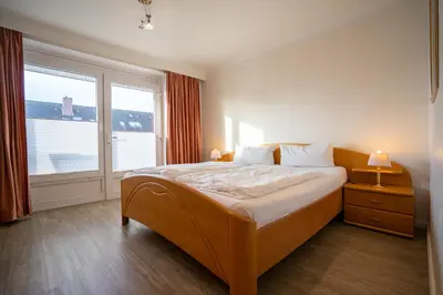 Ein Bett oder Betten in einem Zimmer der Unterkunft Hus Willem Wohnung I 14