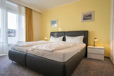 Ein Bett oder Betten in einem Zimmer der Unterkunft Hus Willem Wohnung I 20