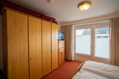 Ein Bett oder Betten in einem Zimmer der Unterkunft Hus Willem Wohnung II 15