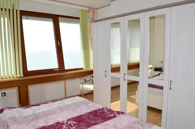 Ein Bett oder Betten in einem Zimmer der Unterkunft Büsumer Hochhaus Wohnung Jacqueline