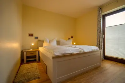 Ein Bett oder Betten in einem Zimmer der Unterkunft Österstr Schmidt