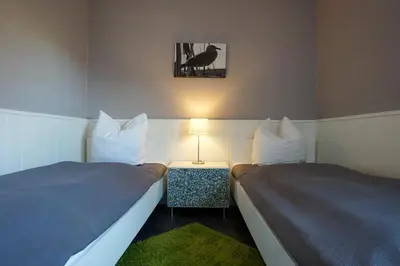Ein Bett oder Betten in einem Zimmer der Unterkunft Viktoriastraße 5 Anja 809