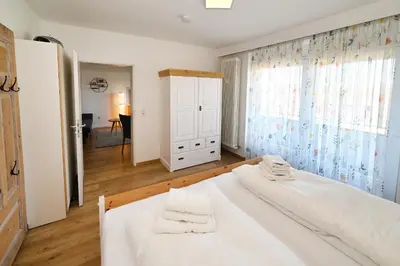 Ein Bett oder Betten in einem Zimmer der Unterkunft Hus Willem Wohnung I 16, Strandläufer