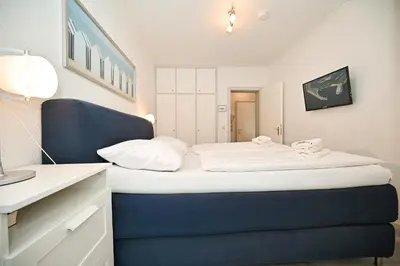 Ein Bett oder Betten in einem Zimmer der Unterkunft Kuschelkajüt