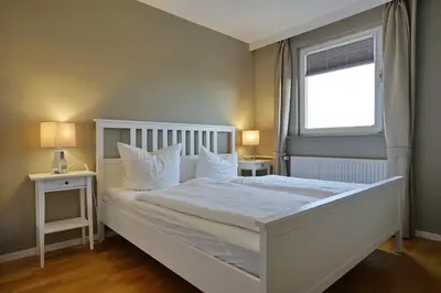 Ein Bett oder Betten in einem Zimmer der Unterkunft Büsumer Hochhaus Wohnung In Lee