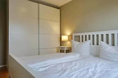 Ein Bett oder Betten in einem Zimmer der Unterkunft Büsumer Hochhaus Wohnung In Lee