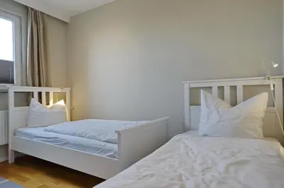 Ein Bett oder Betten in einem Zimmer der Unterkunft Büsumer Hochhaus Wohnung In Lee