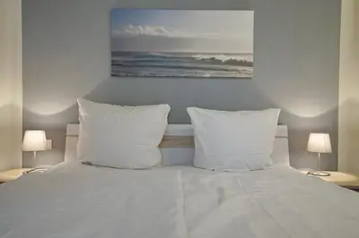 Ein Bett oder Betten in einem Zimmer der Unterkunft Strandgeflüster