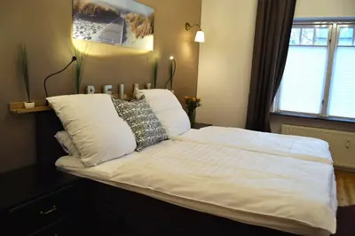 Ein Bett oder Betten in einem Zimmer der Unterkunft Villa Hafenzeit