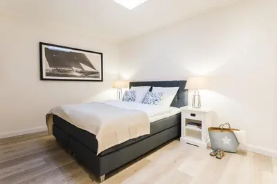 Ein Bett oder Betten in einem Zimmer der Unterkunft Strandvilla Apartment Hafenglück