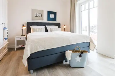 Ein Bett oder Betten in einem Zimmer der Unterkunft Strandvilla Apartment Meeresglück
