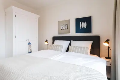Ein Bett oder Betten in einem Zimmer der Unterkunft Strandvilla Apartment Meeresglück