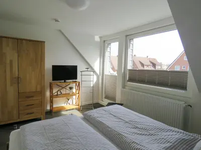 Ein Bett oder Betten in einem Zimmer der Unterkunft Haus zwischen den Deichen Wohnung 2